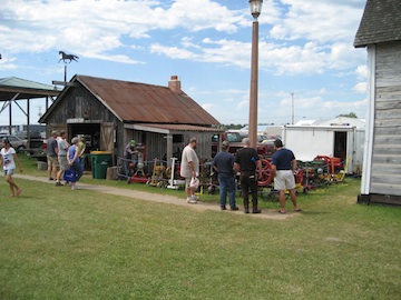 The Blacksmith Building With Adjacent Tractor Display